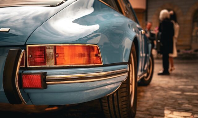 sports car, luxury car, classic car, retro design, blue car, convertible, exhaust, wheels, antique, collector car, taillights, expensive, rubber tires, paint, vintage, brand, asphalt road, outdoors, city, focus on car