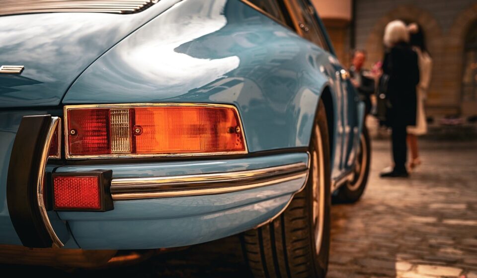 sports car, luxury car, classic car, retro design, blue car, convertible, exhaust, wheels, antique, collector car, taillights, expensive, rubber tires, paint, vintage, brand, asphalt road, outdoors, city, focus on car