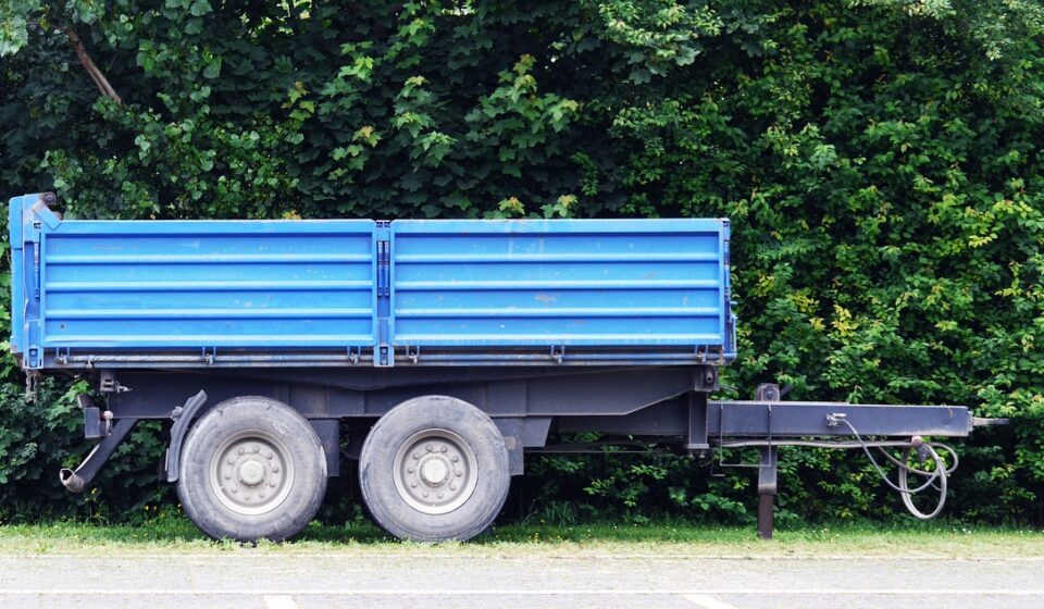 follower, tractor, blue, turned off, agriculture, transport, commercial vehicle, tipper, tandem tires, fields, farm yard, field work, working device, construction site